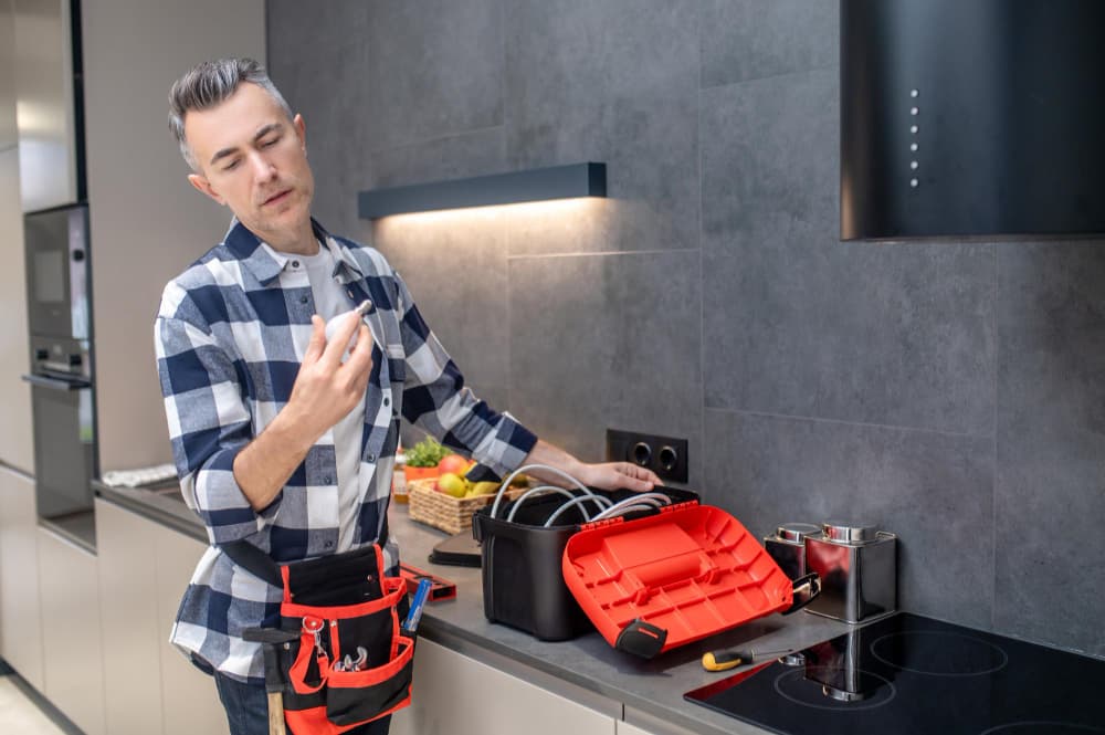 plumber inspecting gas pipe part